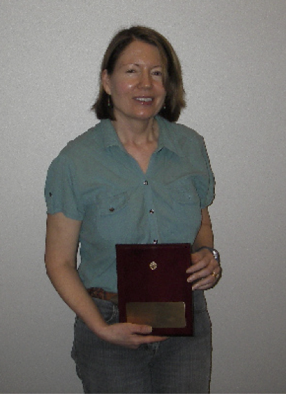 Fran Van Cleave holds the Hall of Fame Award